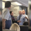 American Airlines Flight Attendant Challenges Passenger To Fight, 