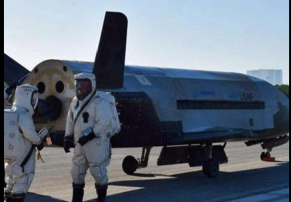 Military space plane lands after secret mission