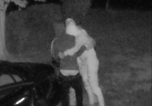 Surveillance video catches thieves hugging excitedly after finding money in an unlocked car