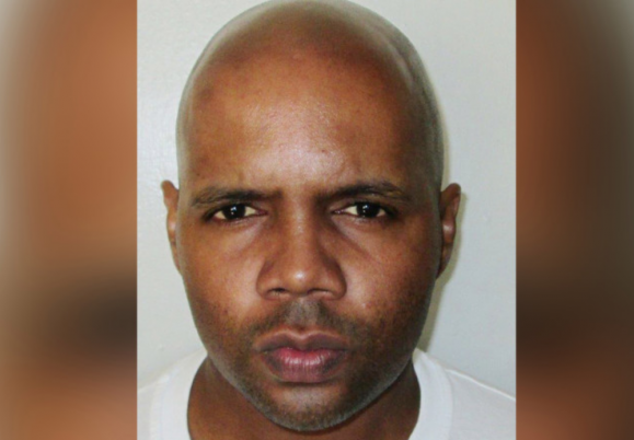 Cop killer flips the bird as he’s given...